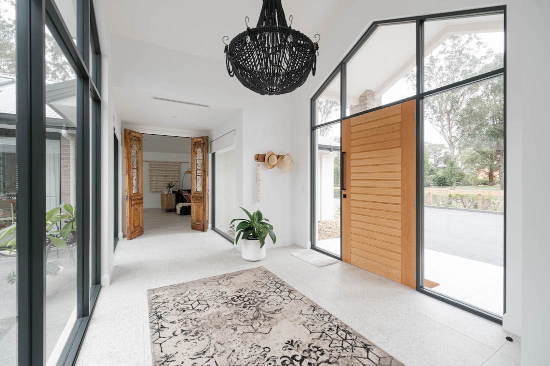 Entry and breezeway with floor runner and beaded light fitting