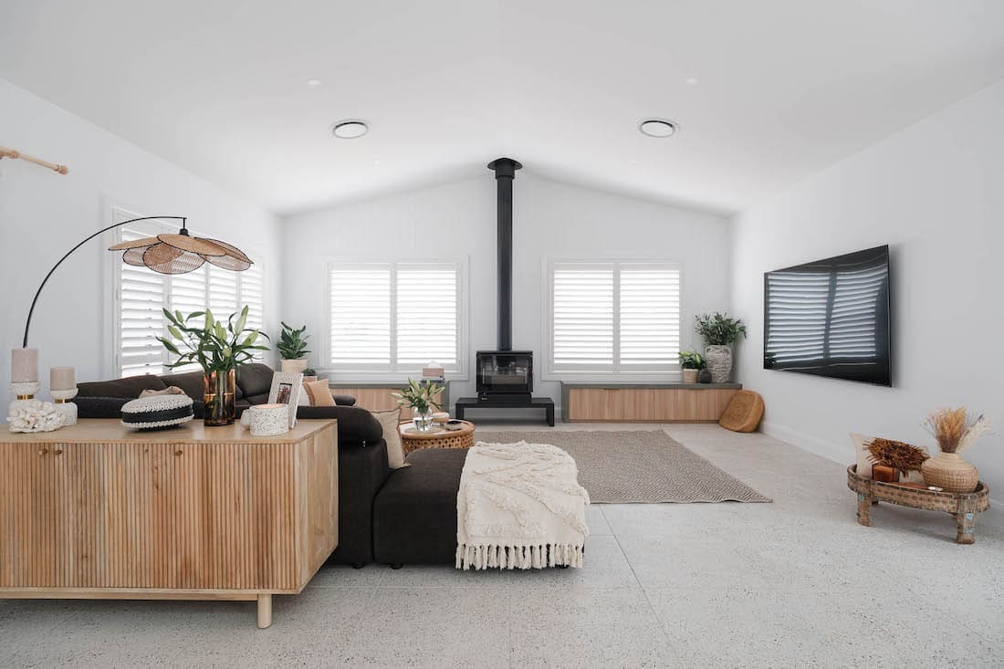 Living room with pitched roof and fireplace