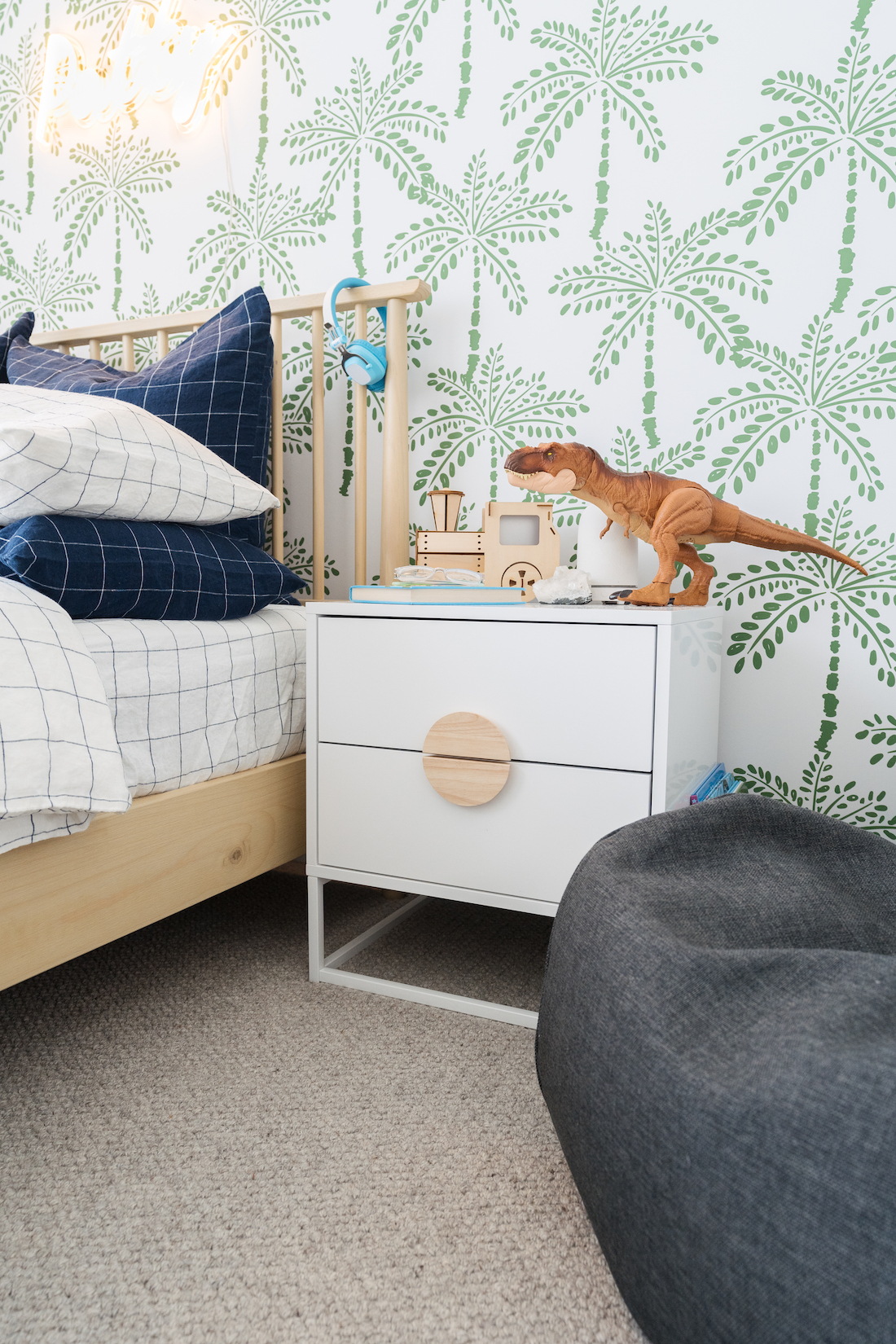 Palm print wallpaper was the inspiration in this boy's bedroom design