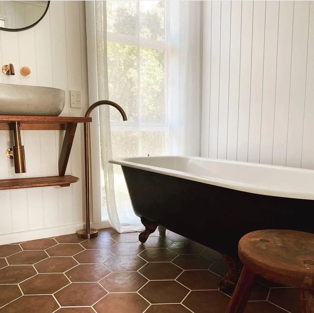 black bath with terracotta tile inspo 