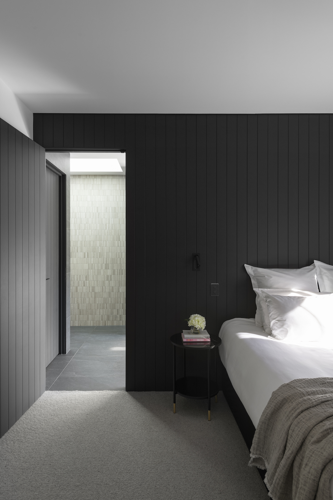 black wall panelling in bedroom