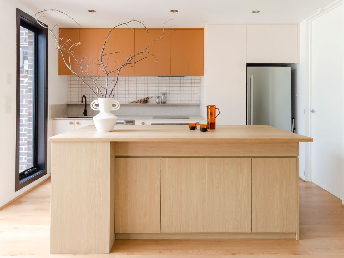 Kitchen design trends include greater use of colour like this orange kitchen 