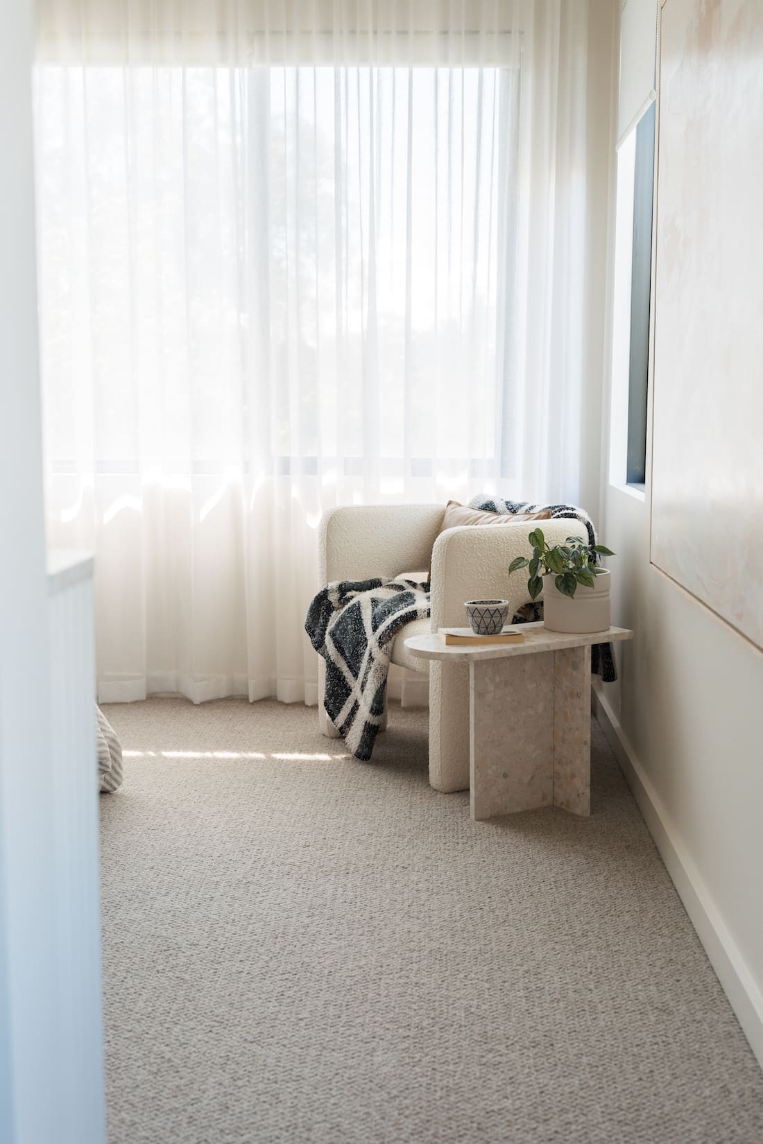 Cosy armchair nook in bedroom