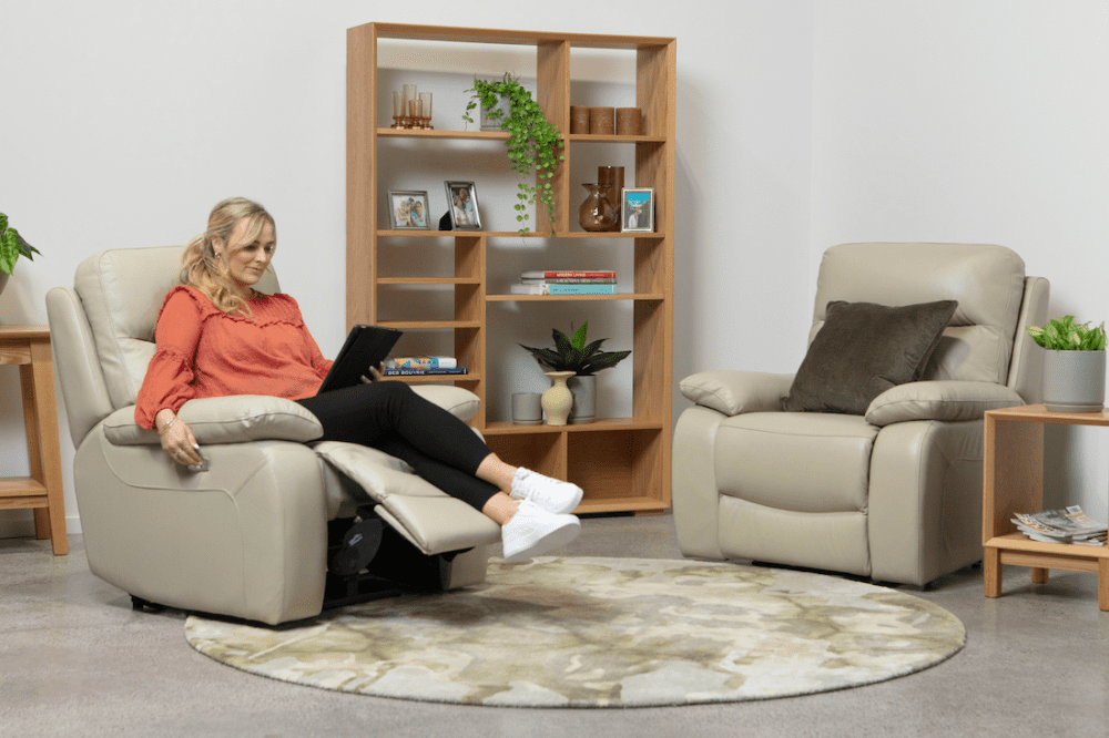 La-Z-Boy beige recliner in sitting room with bookshelf