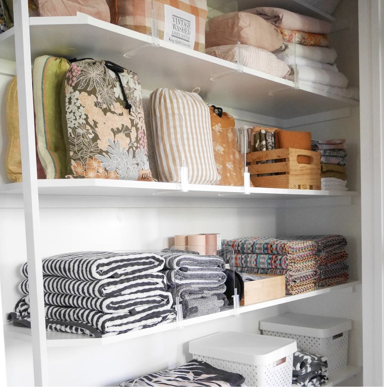 Shelf dividers in linen closet