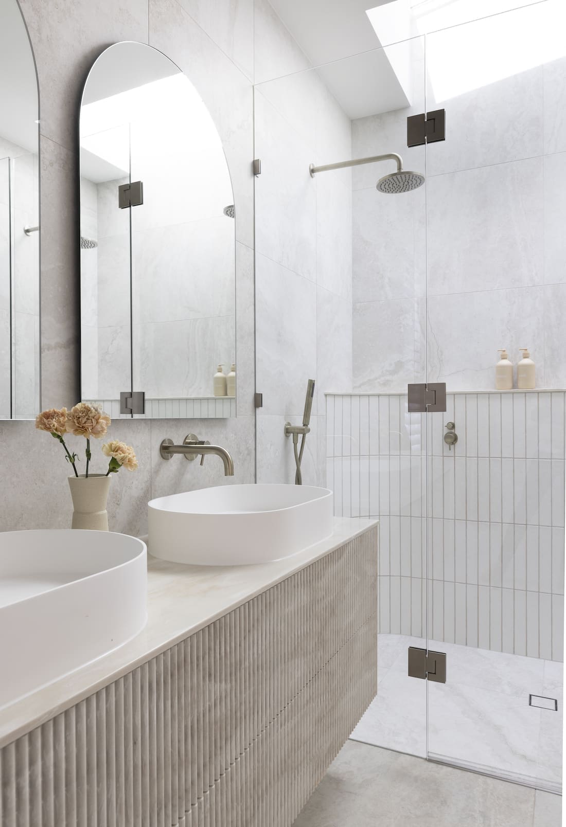 Bathroom with double vanity and walk in shower