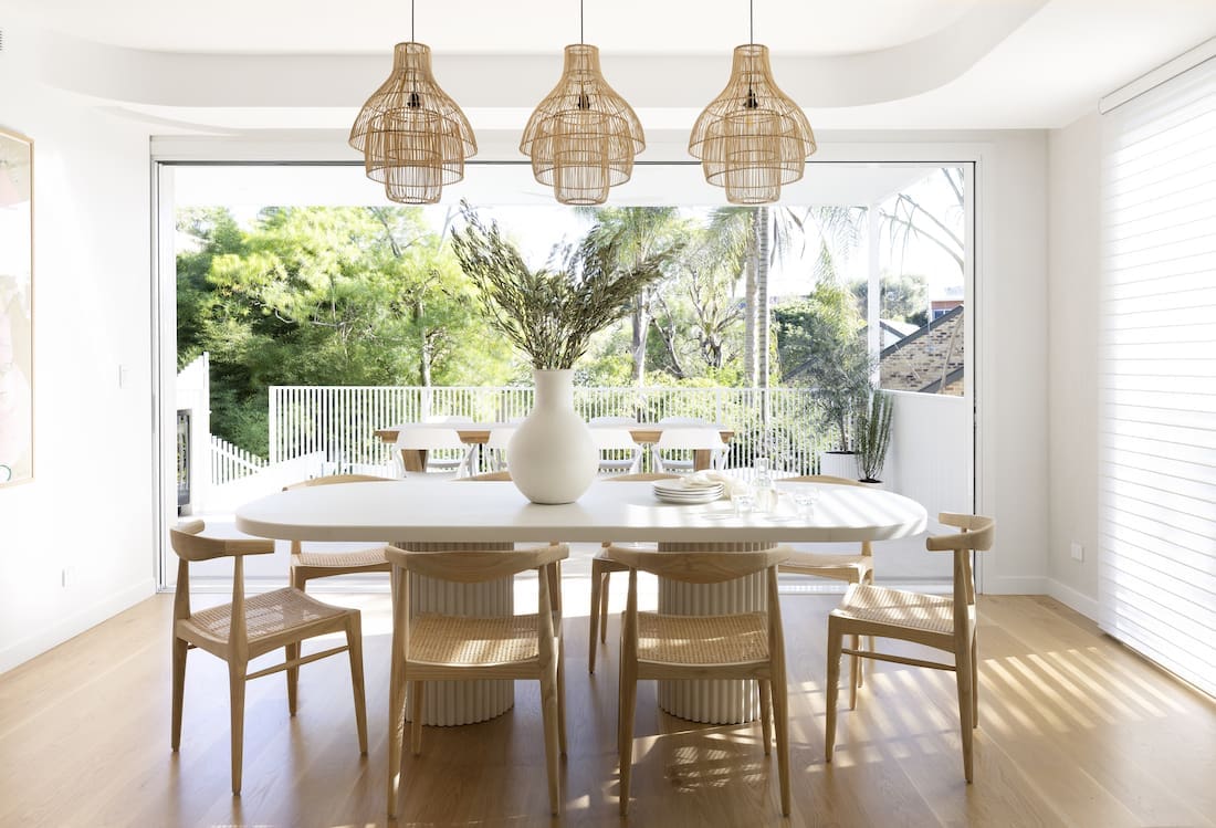 Custom built dining table with 3 basket pendant lights above