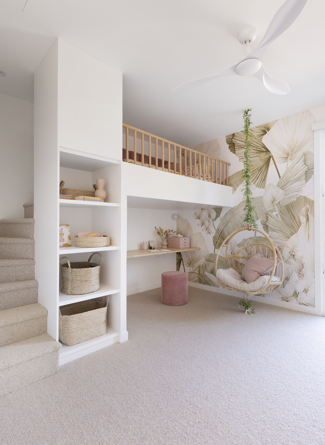 Tween girl bedroom with floral wallpaper and loft bed