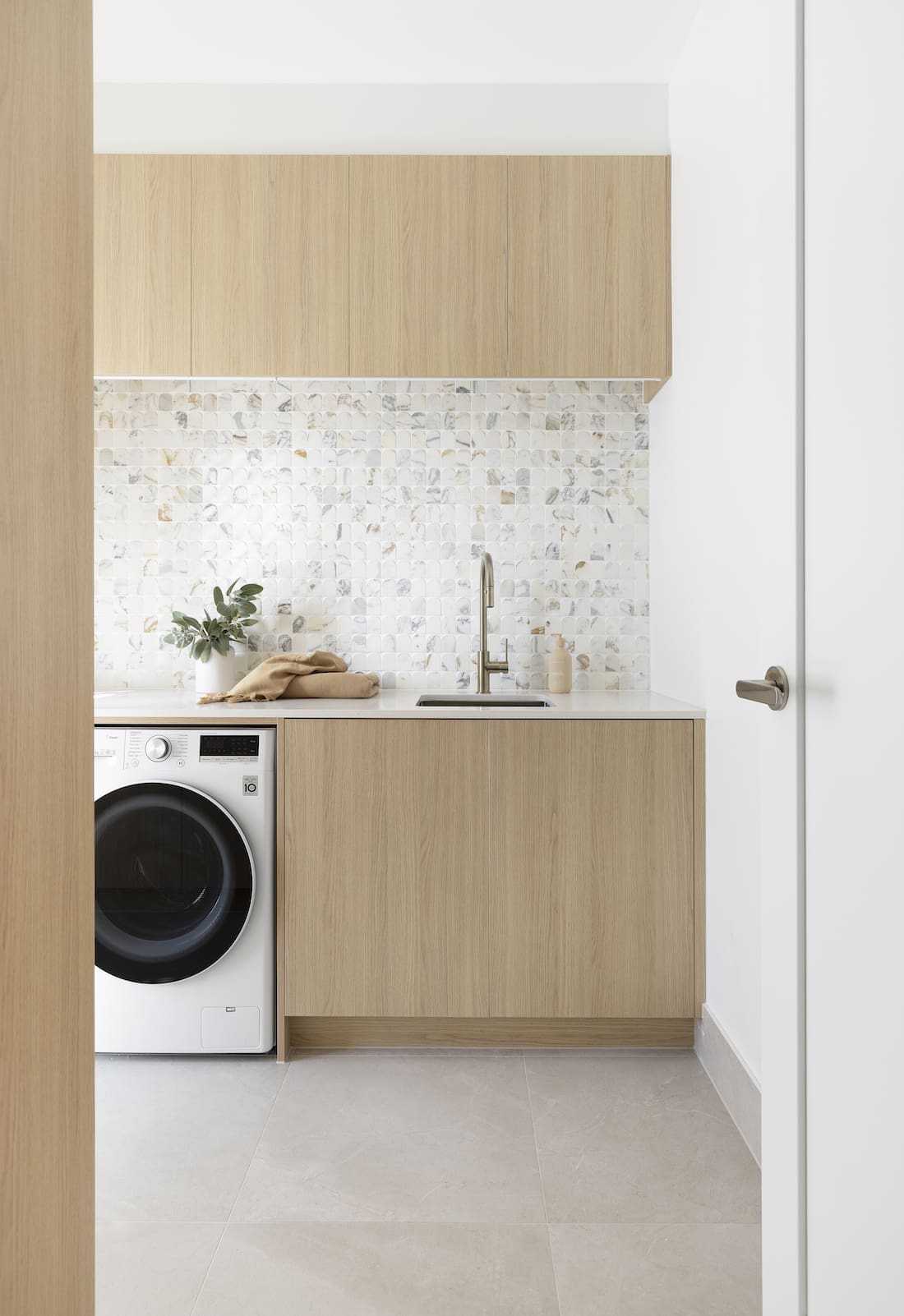 Timber and white laundry with statement splashback