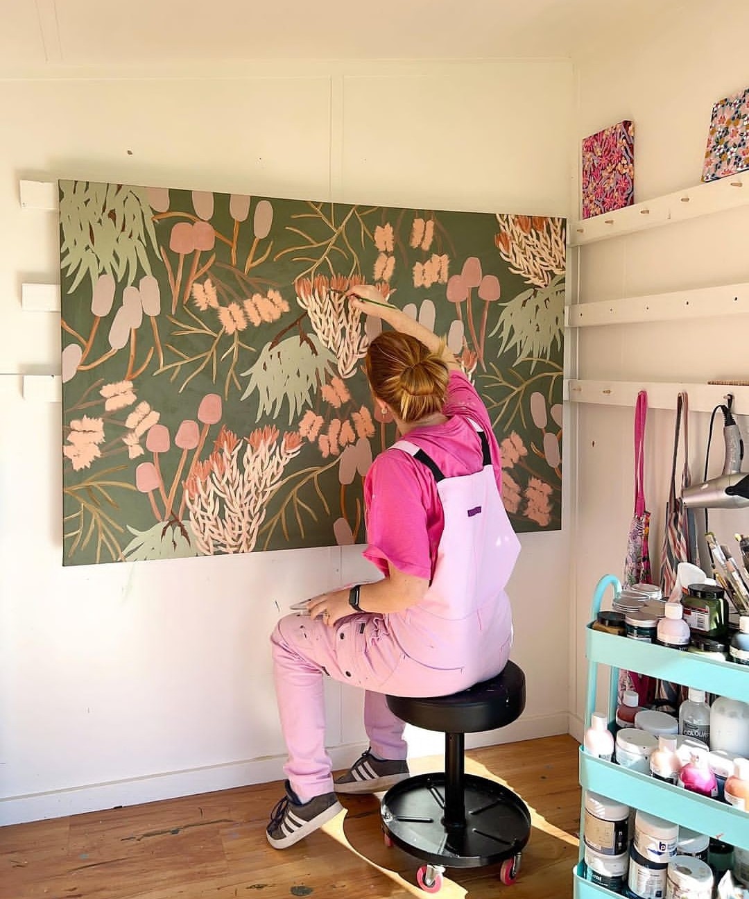 Amy Gibbs painting in her studio