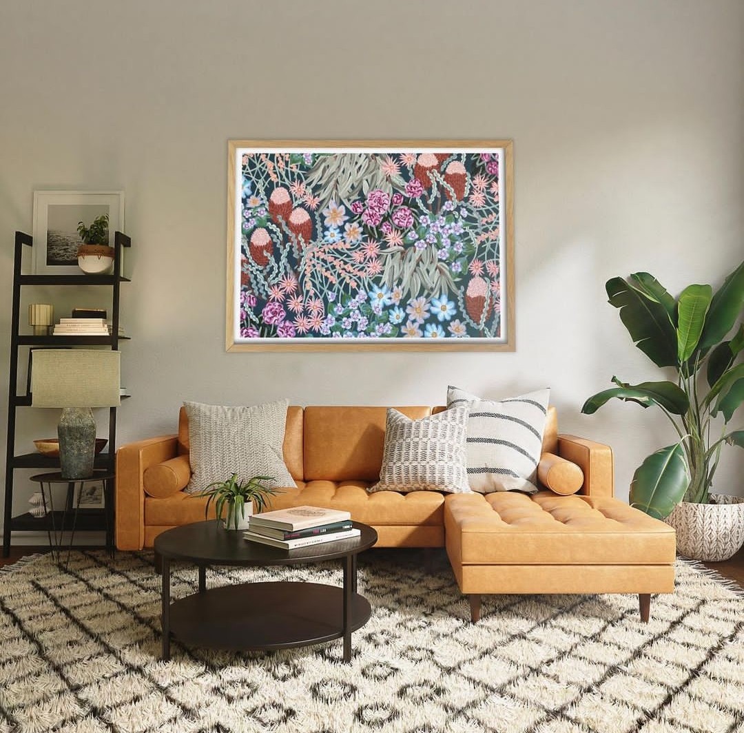 Living room with floral art on wall by Amy Gibbs