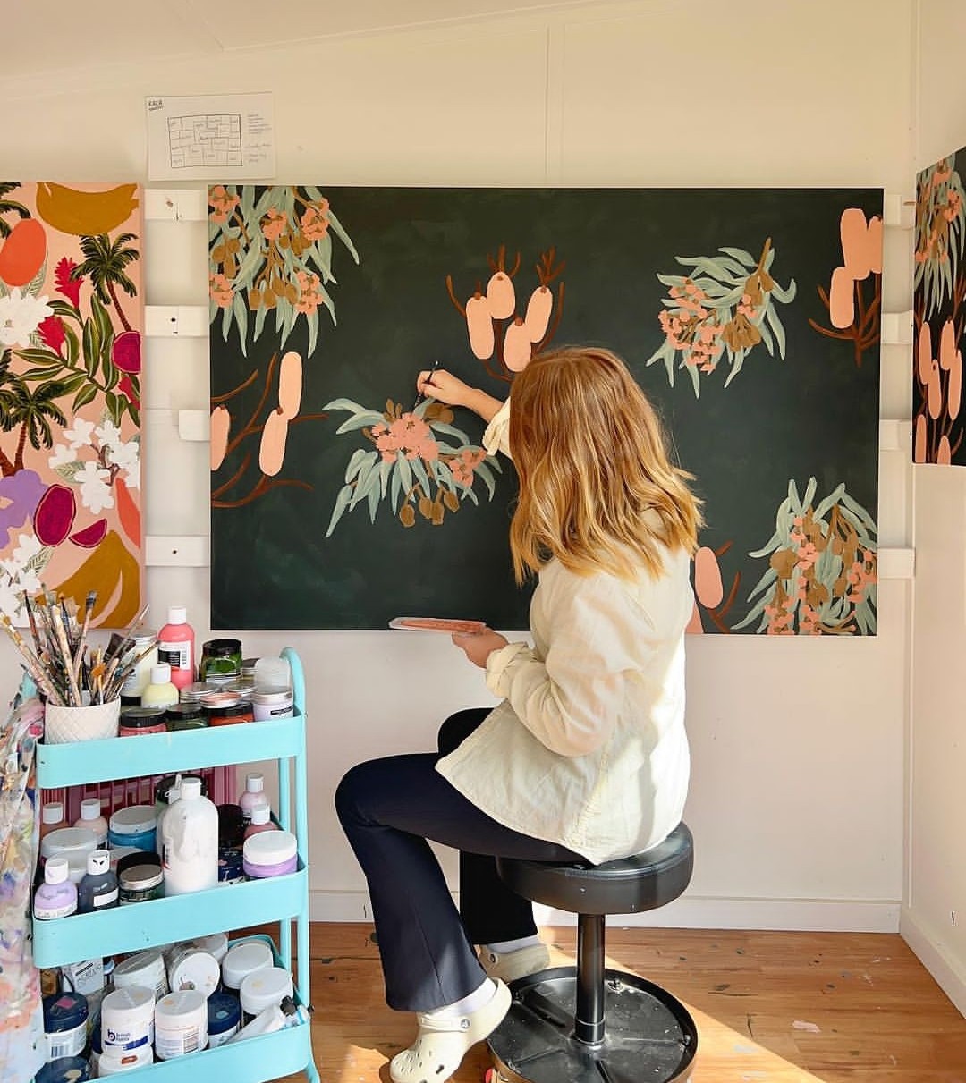 Amy Gibbs painting artwork in studio