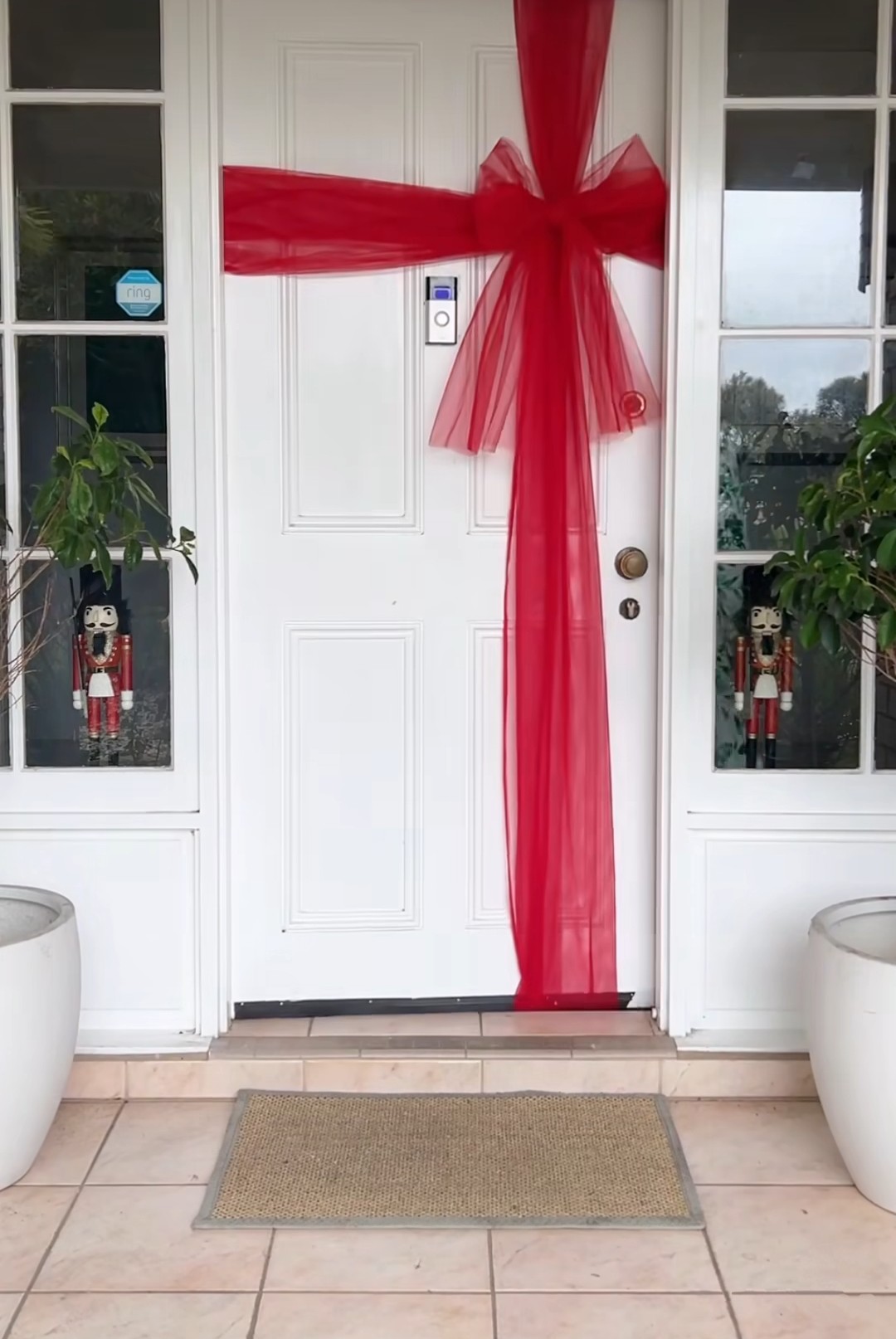 DIY red bow on front door for Christmas