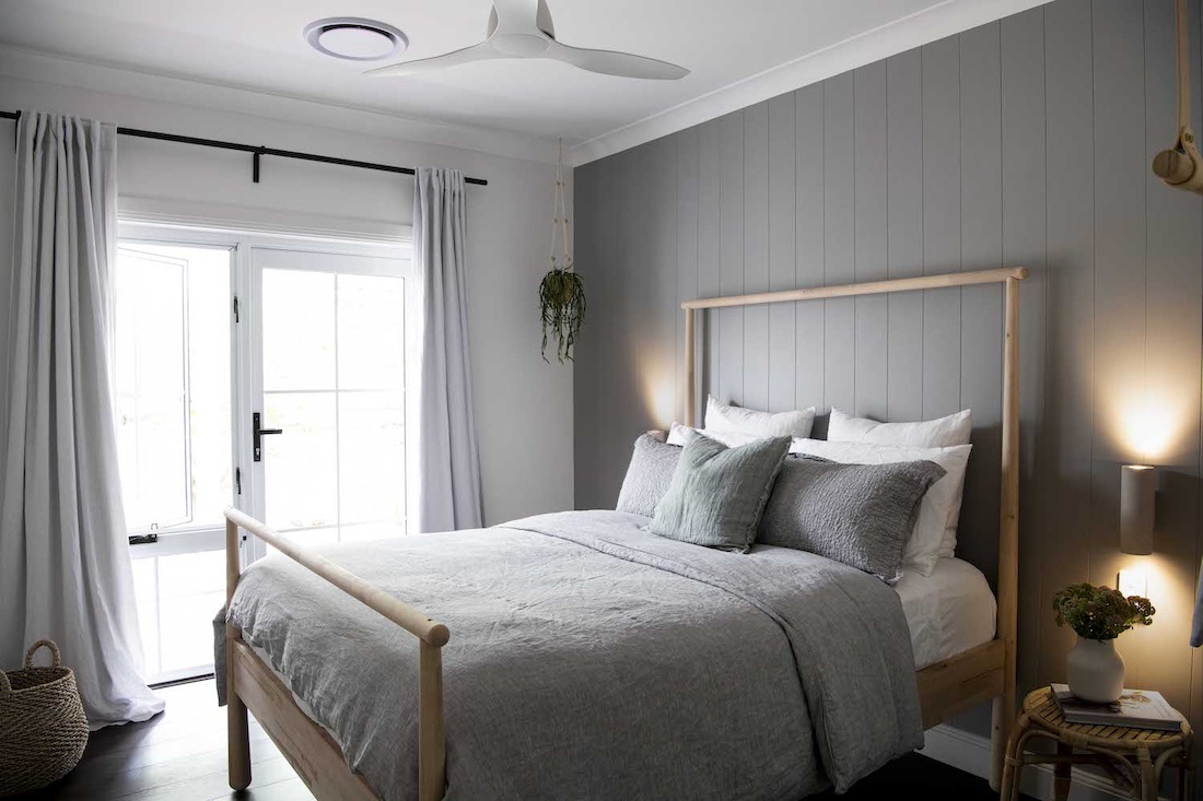 Timber bed with grey bedding