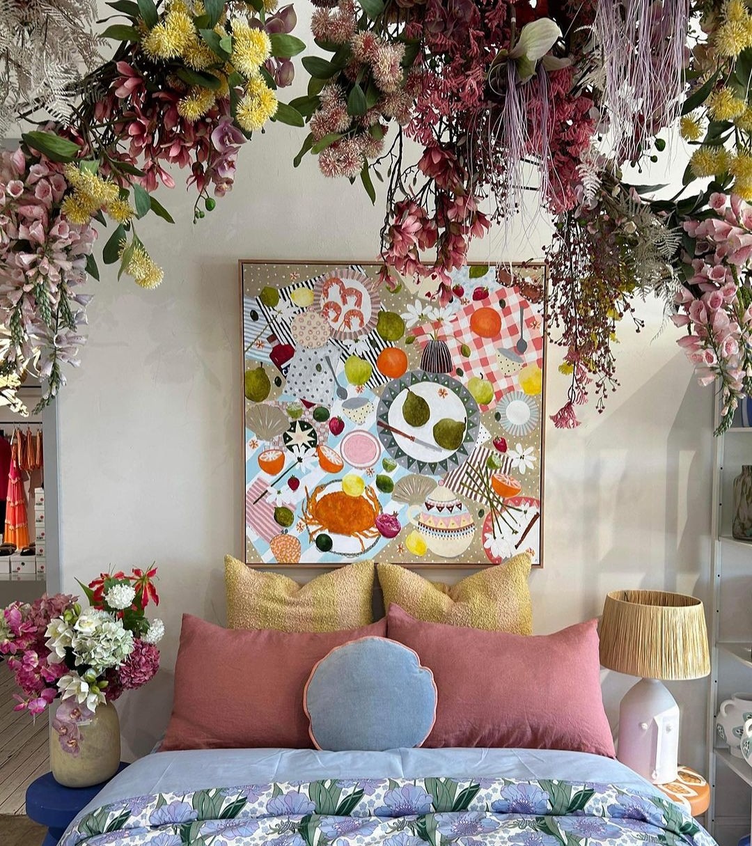 Alexandra Strong Art dining art above bed with floral canopy