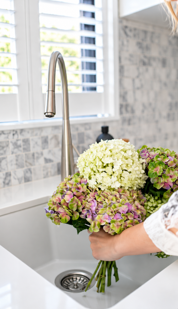 Hydrangeas in a Sunlit Kitchen Sink