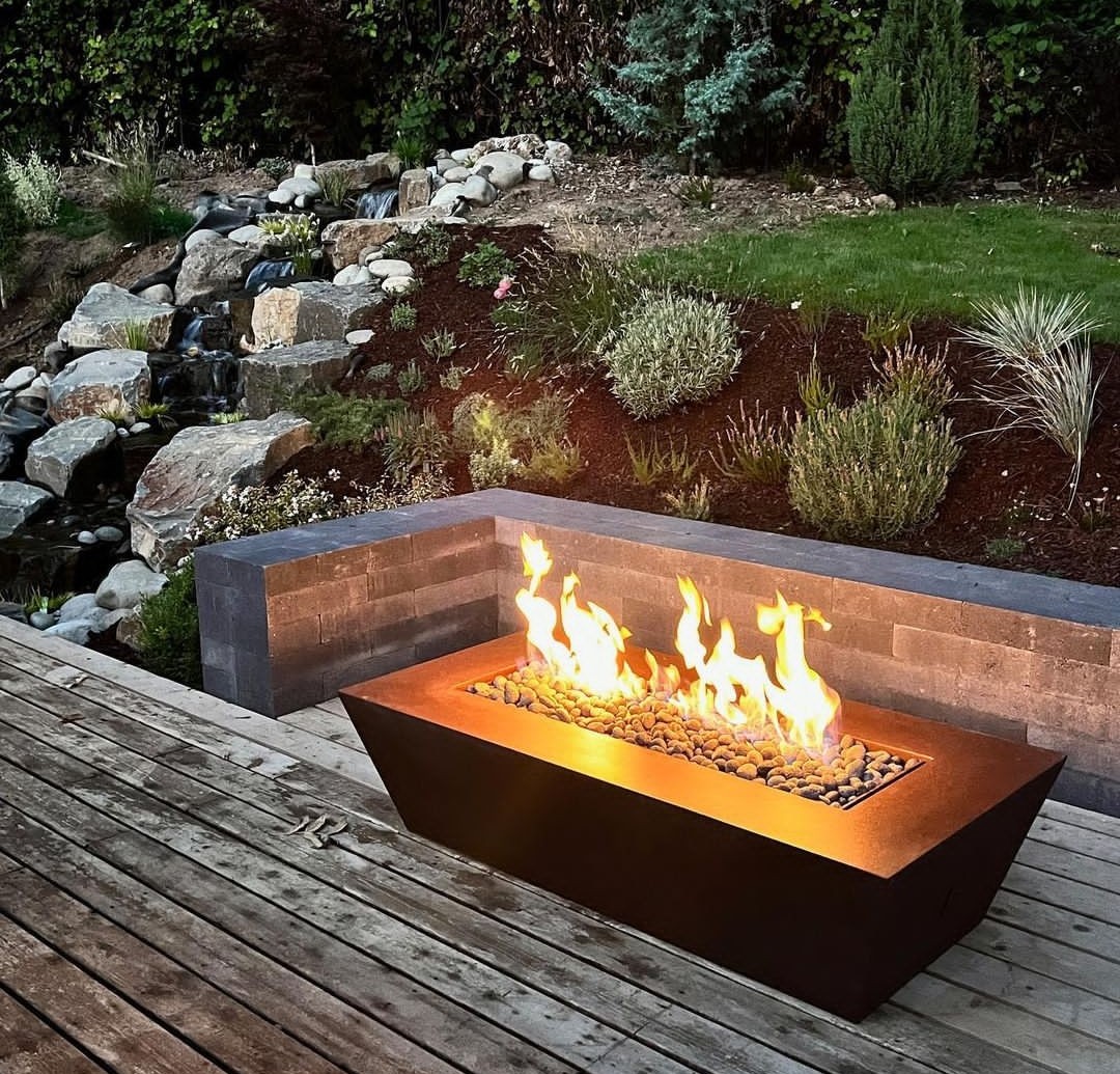 Rectangle firepit in front of retaining wal