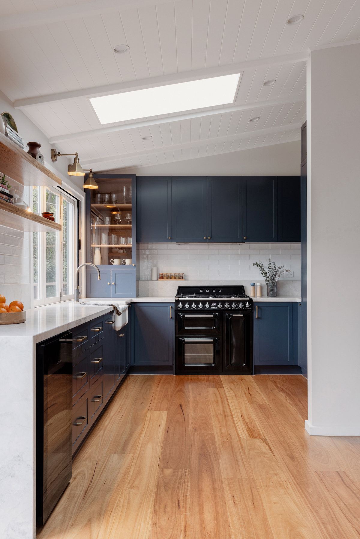 Wide view of luxury blue kitchen