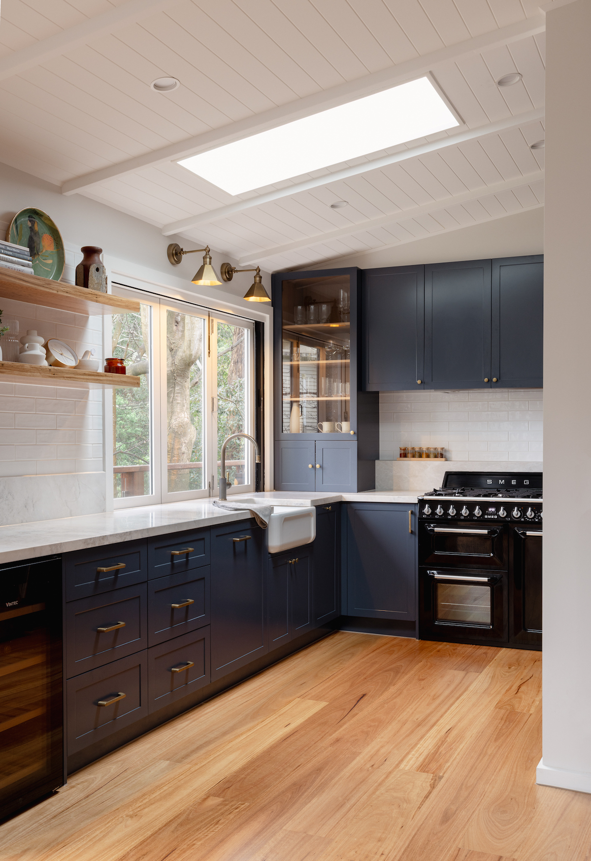 Skylight in farmhouse meets contemporary style kitchen