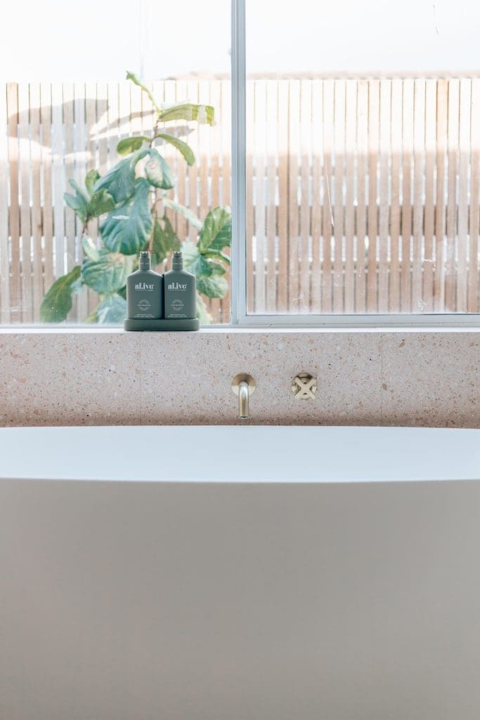 Beautiful bath tub next to window with bath wall spout