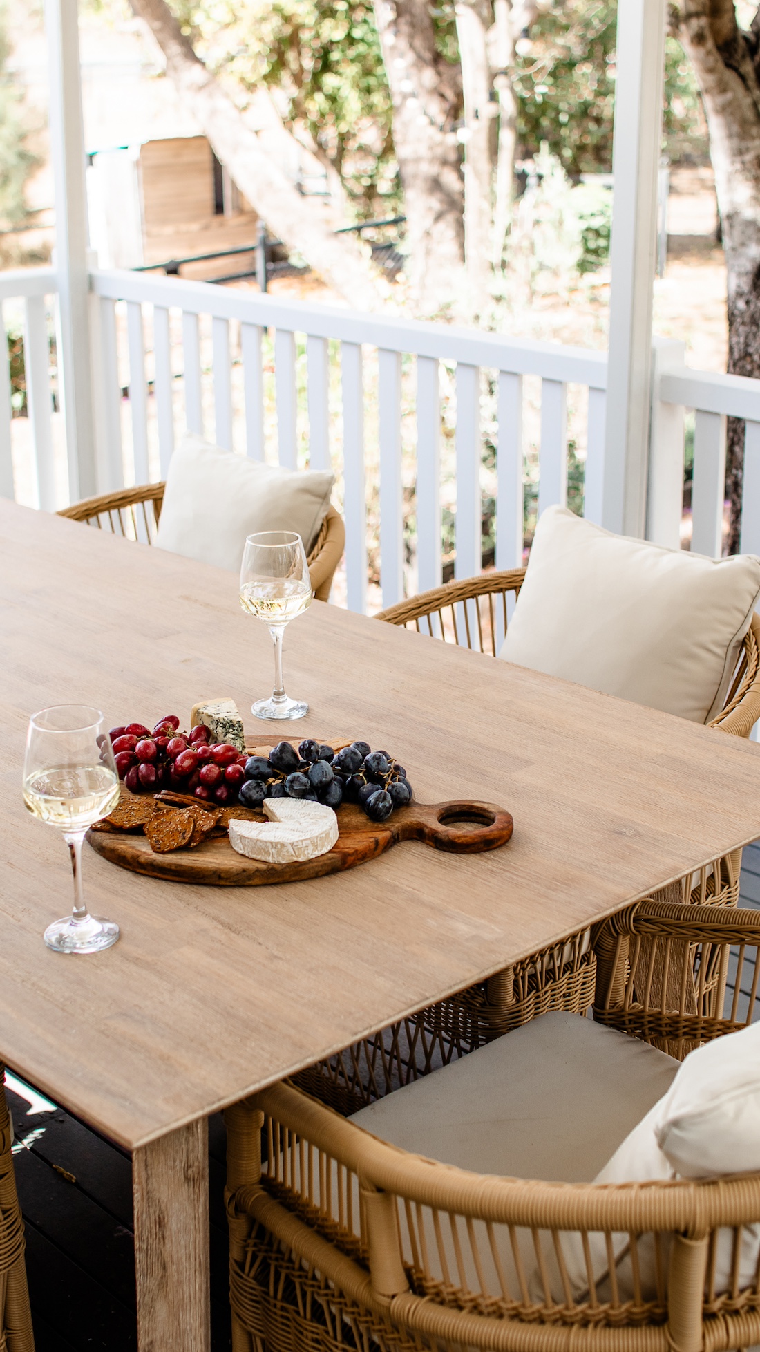 Summerholm House outdoor dining with cheeseboard and wine