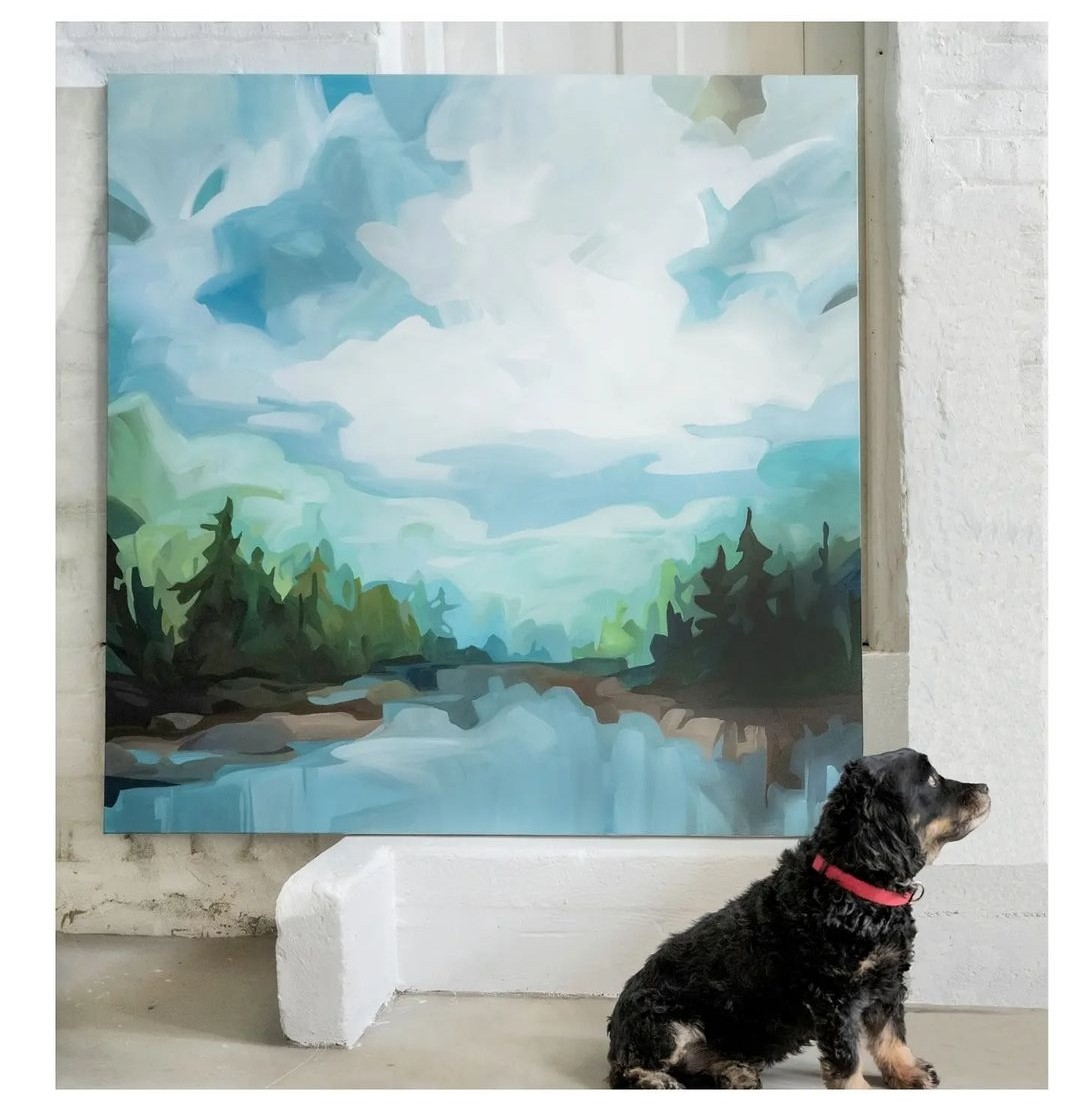Blue lake landscape abstract art with dog in front of canvas