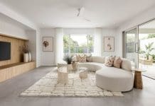 Are ceiling fans in living rooms out of style? Open plan living room with timber joinery