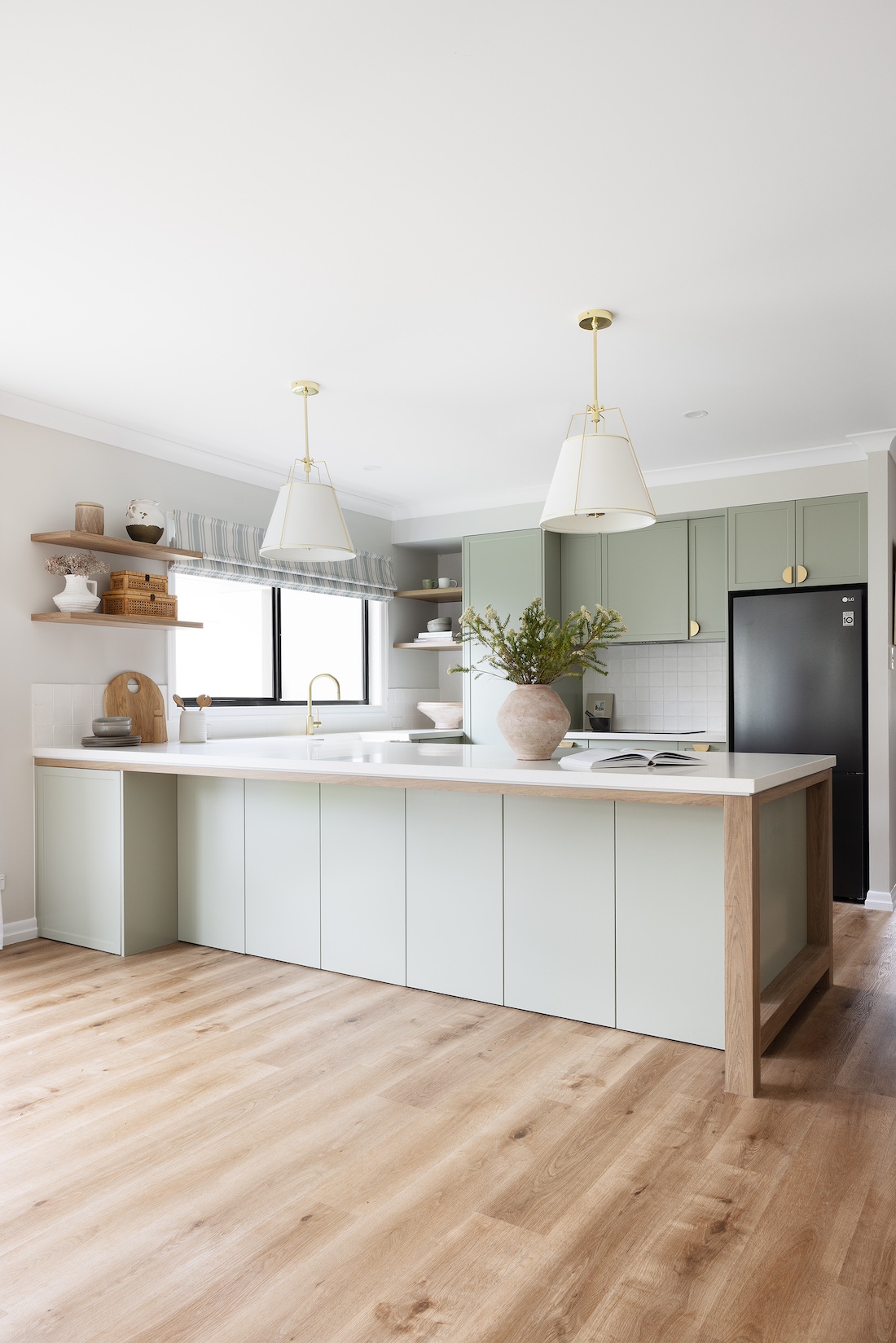 Green cabinetry in modern farmhouse kitchen