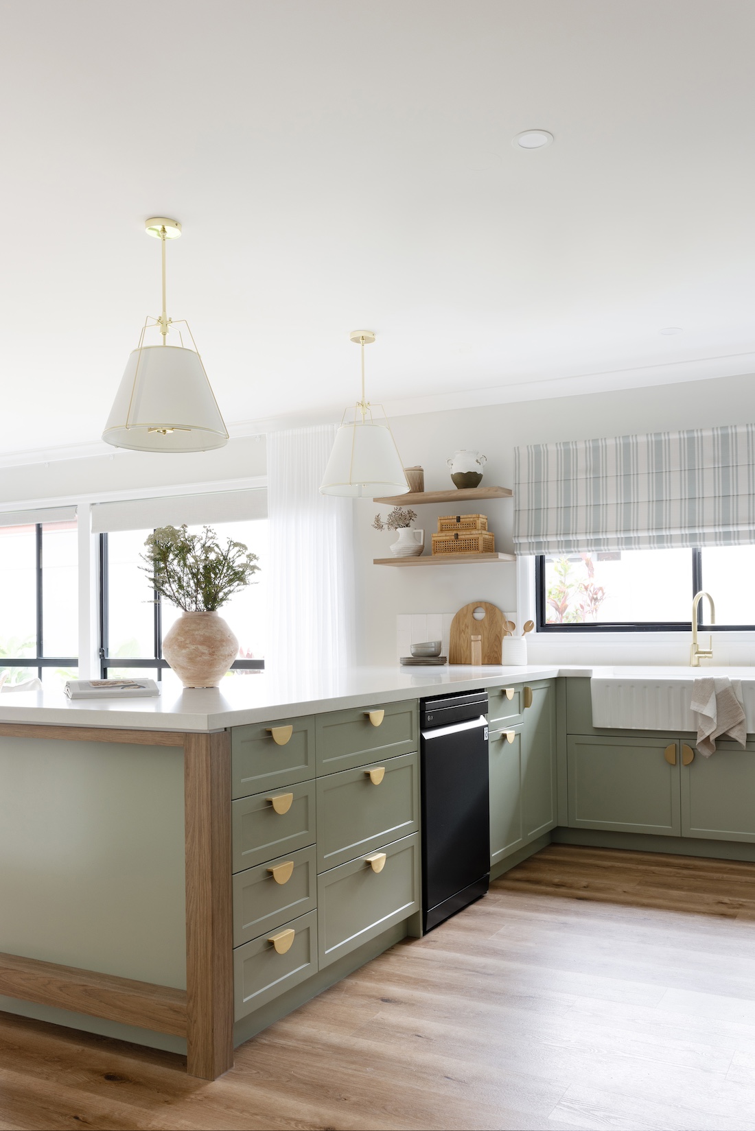 Green cabinetry in modern farmhouse kitchen