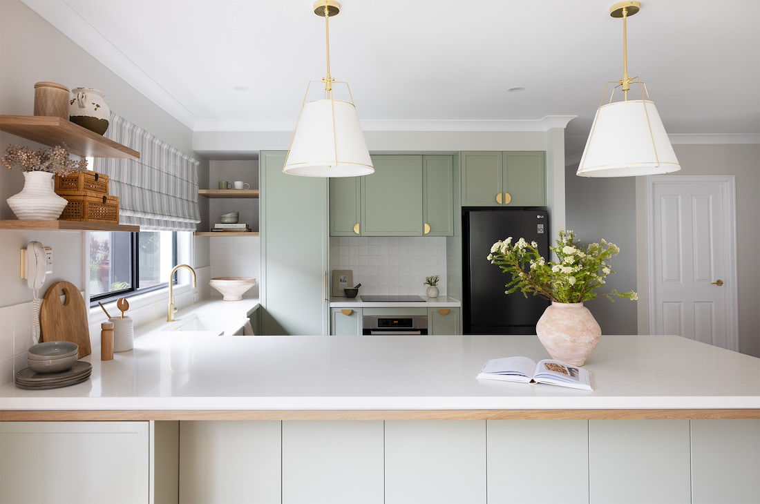 Large double pendant lights over modern farmhouse kitchen island