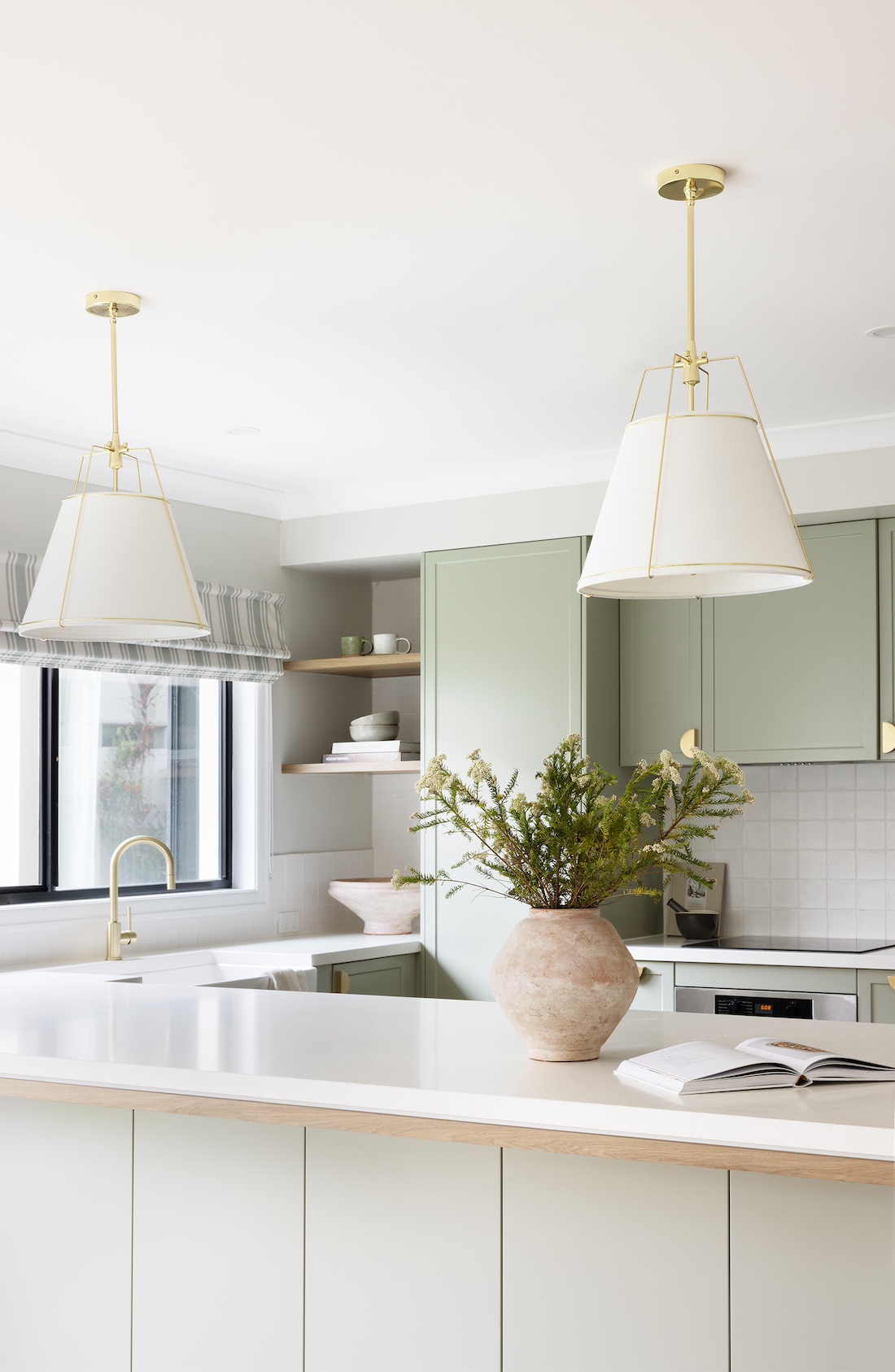 White triangle pendant lights in modern farmhouse kitchen