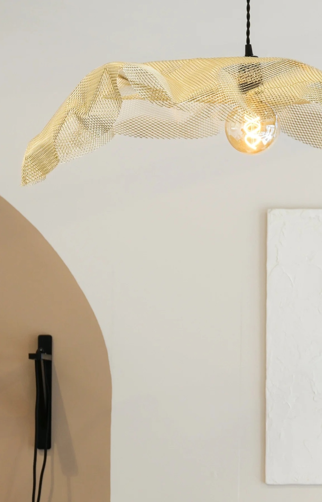 Gold mesh pendant light by Flavie Peartree