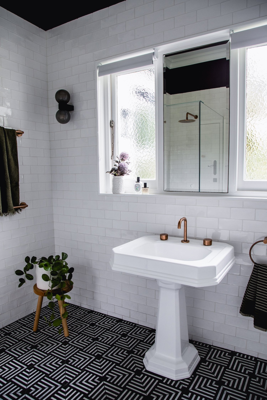 Art deco style pedestal sink and patterned tile floor in Wattle Valley Road by Picchio Interiors