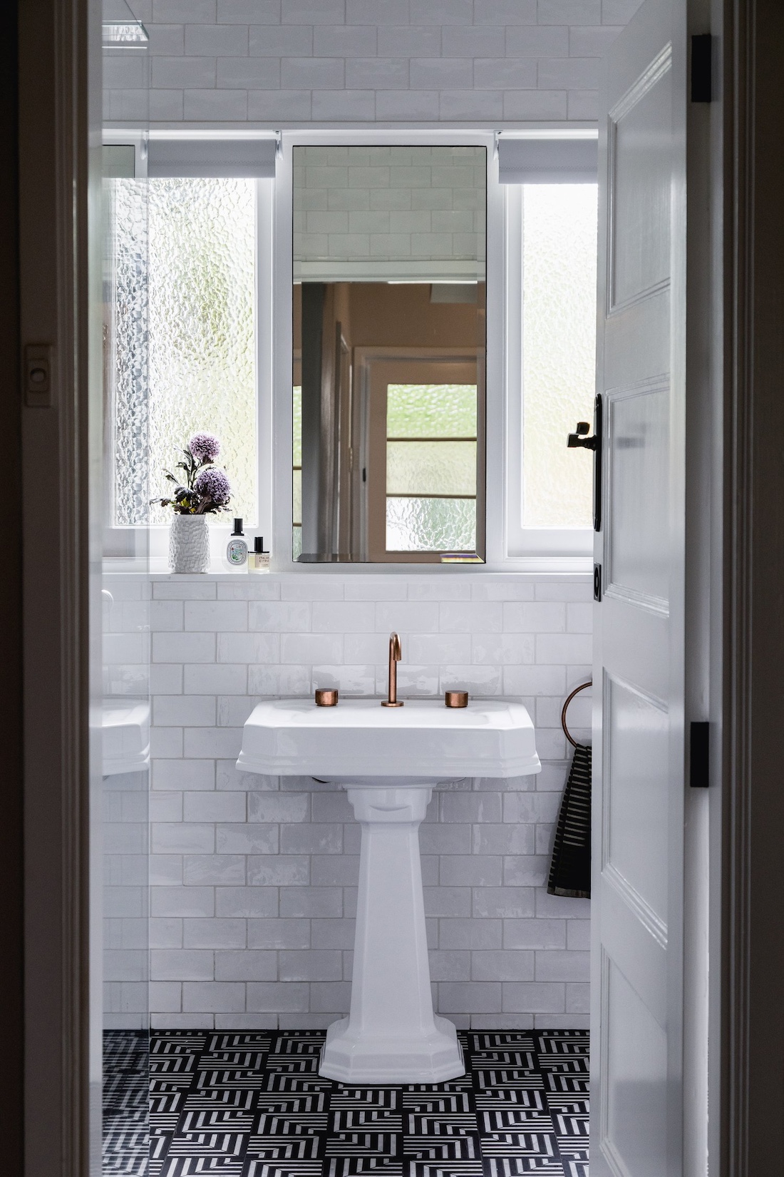 Art deco sink and flooring in bathroom at Wattle Valley Road by Picchio Interiors