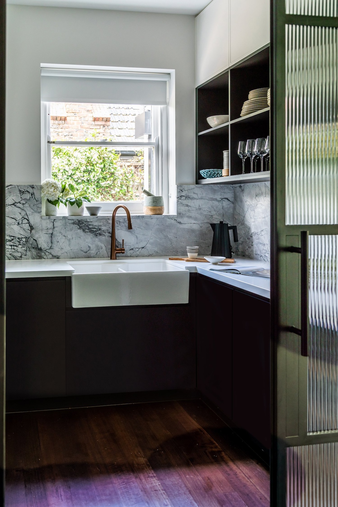 Black cabinetry in butlers pantry with reeded glass door in Wattle Valley Road by Picchio Interiors