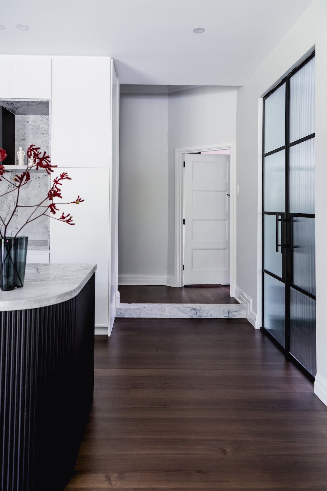 Reeded glass door and curved island bench in Wattle Valley Road by Picchio Interiors