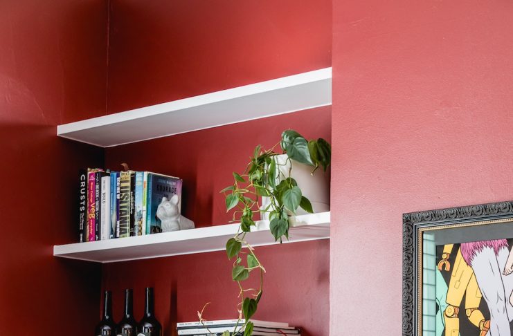 Red wall in living room with bar