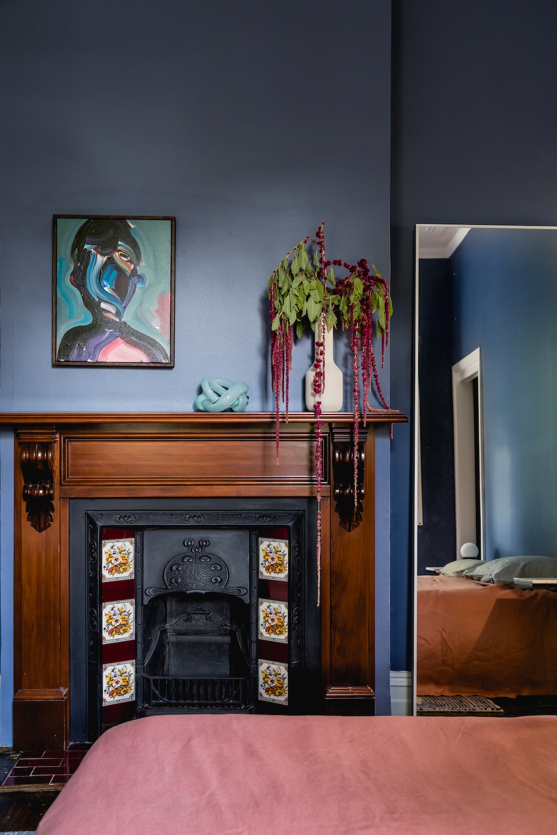 Carnegie Cottage blue wall bedroom with fireplace