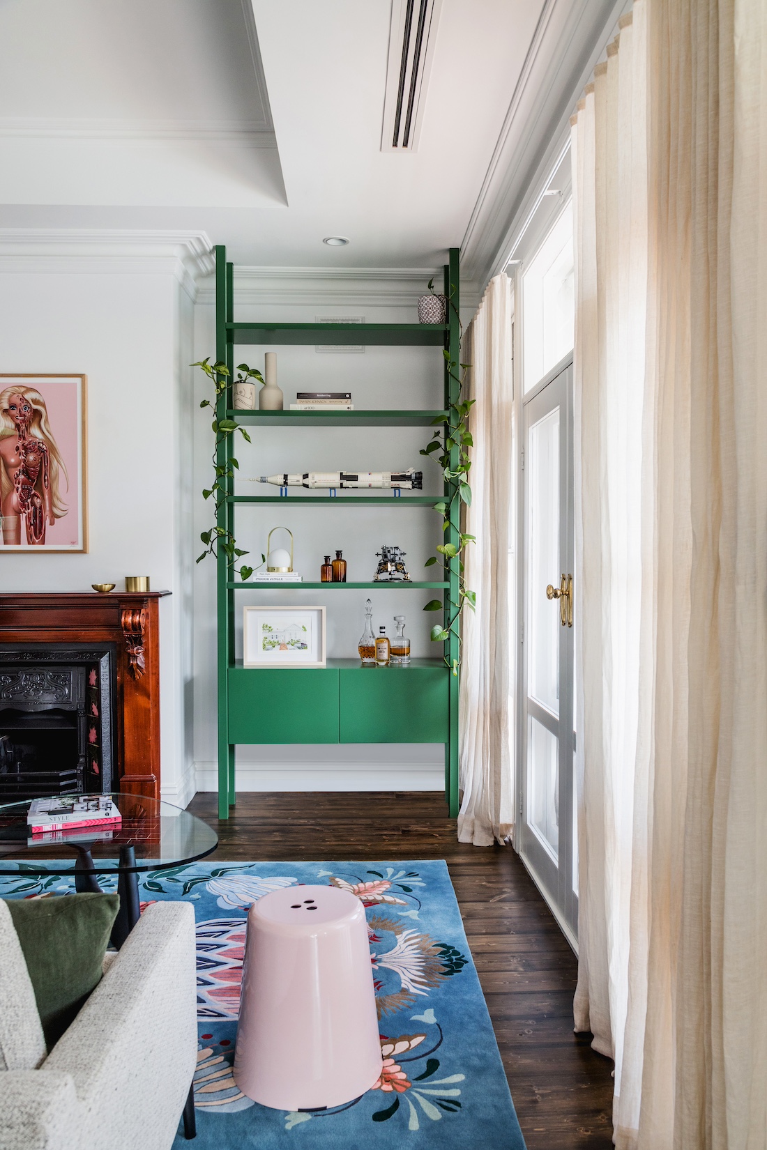 Carnegie Cottage green shelving next to fireplace