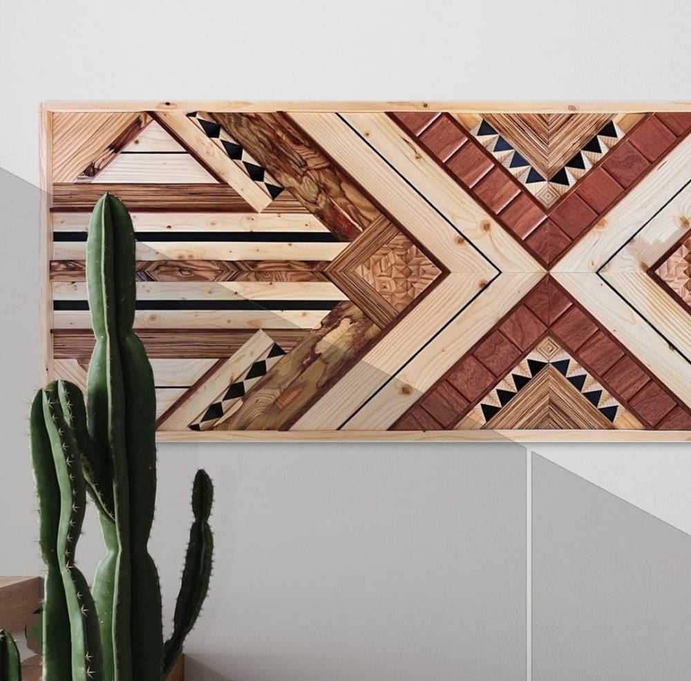 Wooden wall art with different sized timber inlay