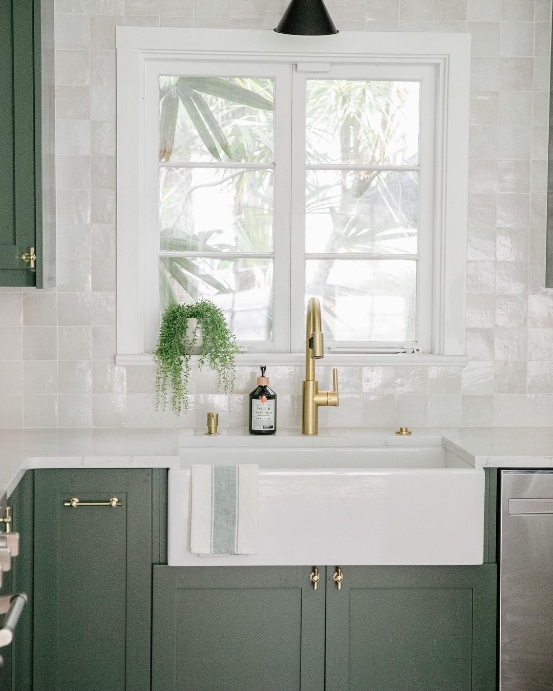 Zellige tiles in kitchen with green cabinetry