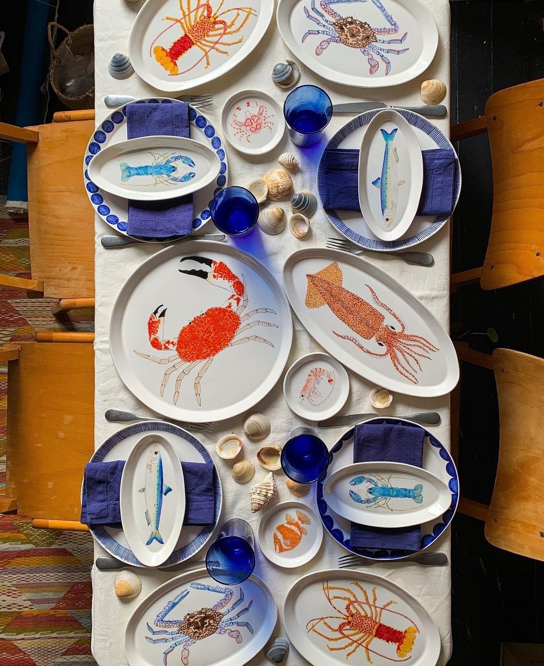 Blue tablescape with various sea creature platters by Casa Adams Fine Wares