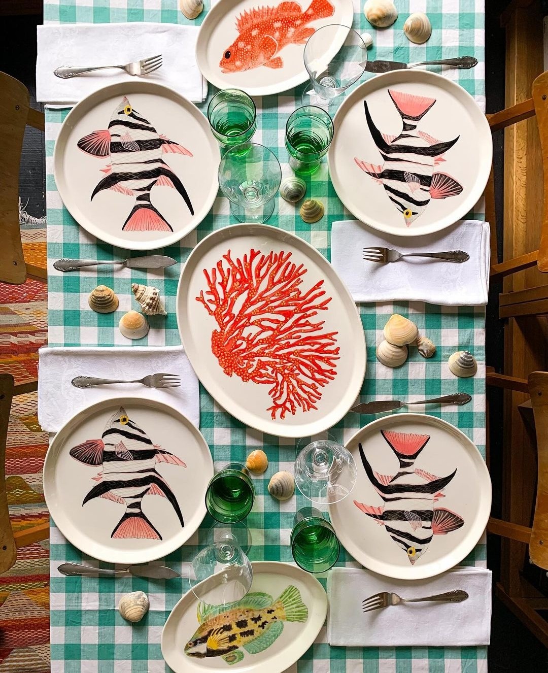 Tablescape with coral and fish plates from Casa Adams Fine Wares