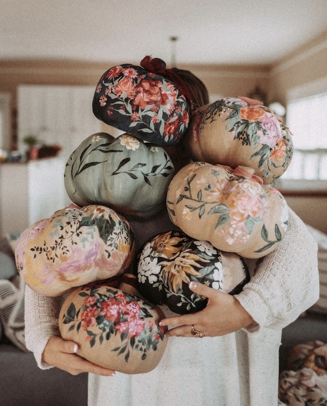 Stack of floral painted pumpkins