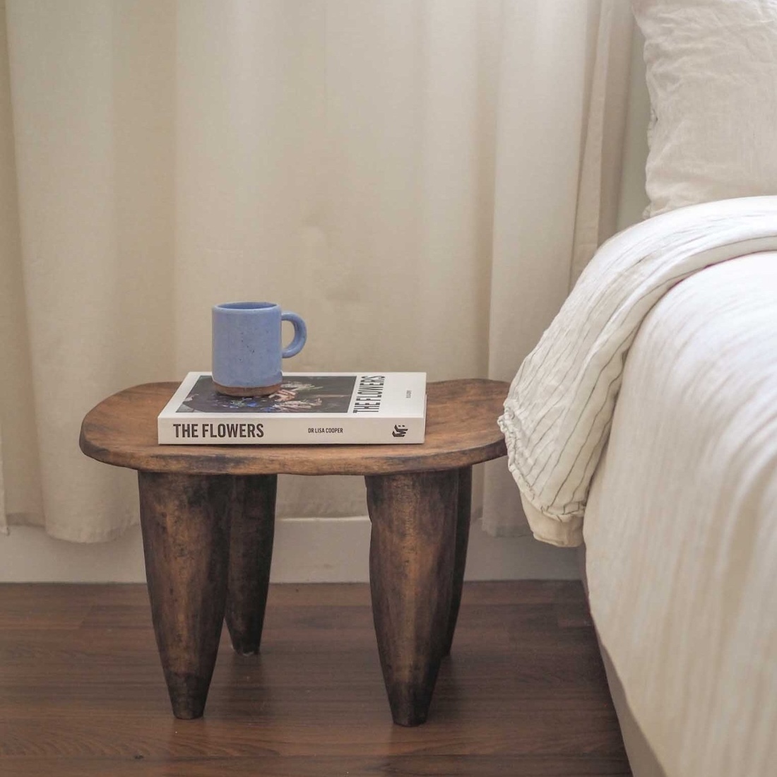 Blue mug on side table by Ochre Ceramics