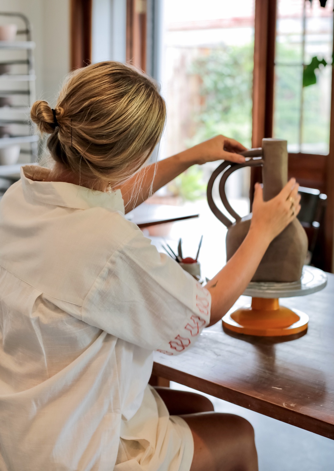 Lauren from Ochre Ceramics working on a ceramic piece