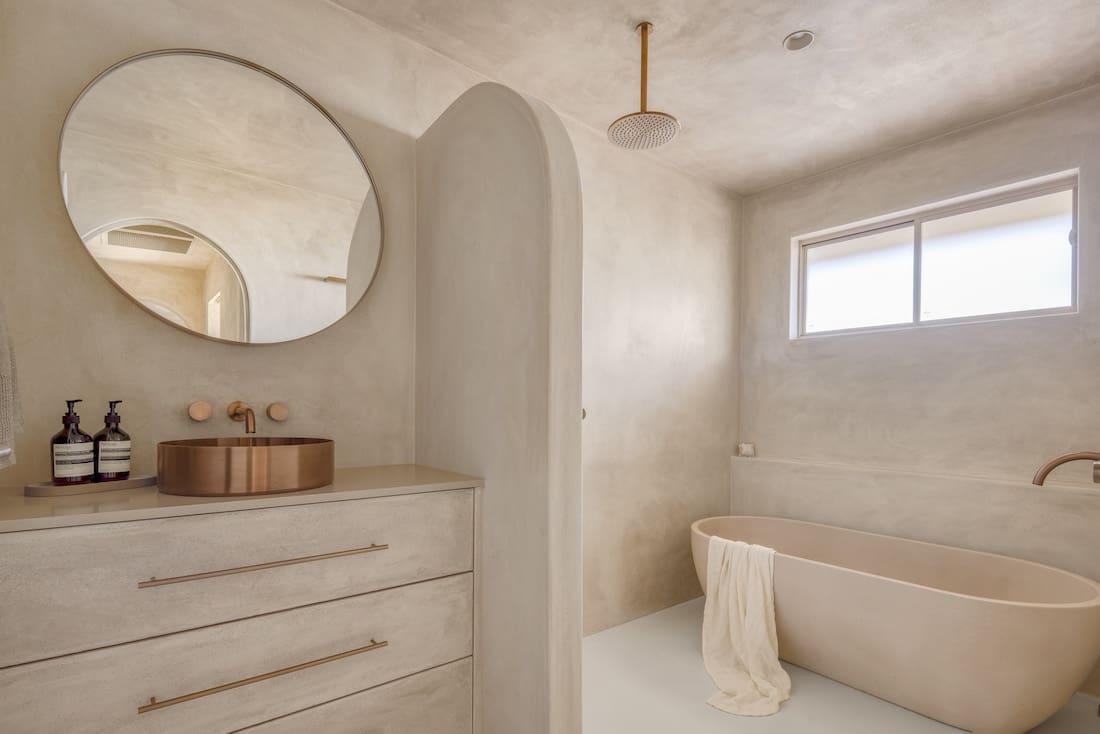 Curved features in Ruin X house bathroom