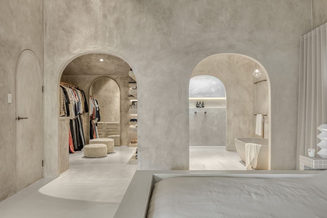 Curved doorways in Ruin X house bathroom and walk in wardrobe