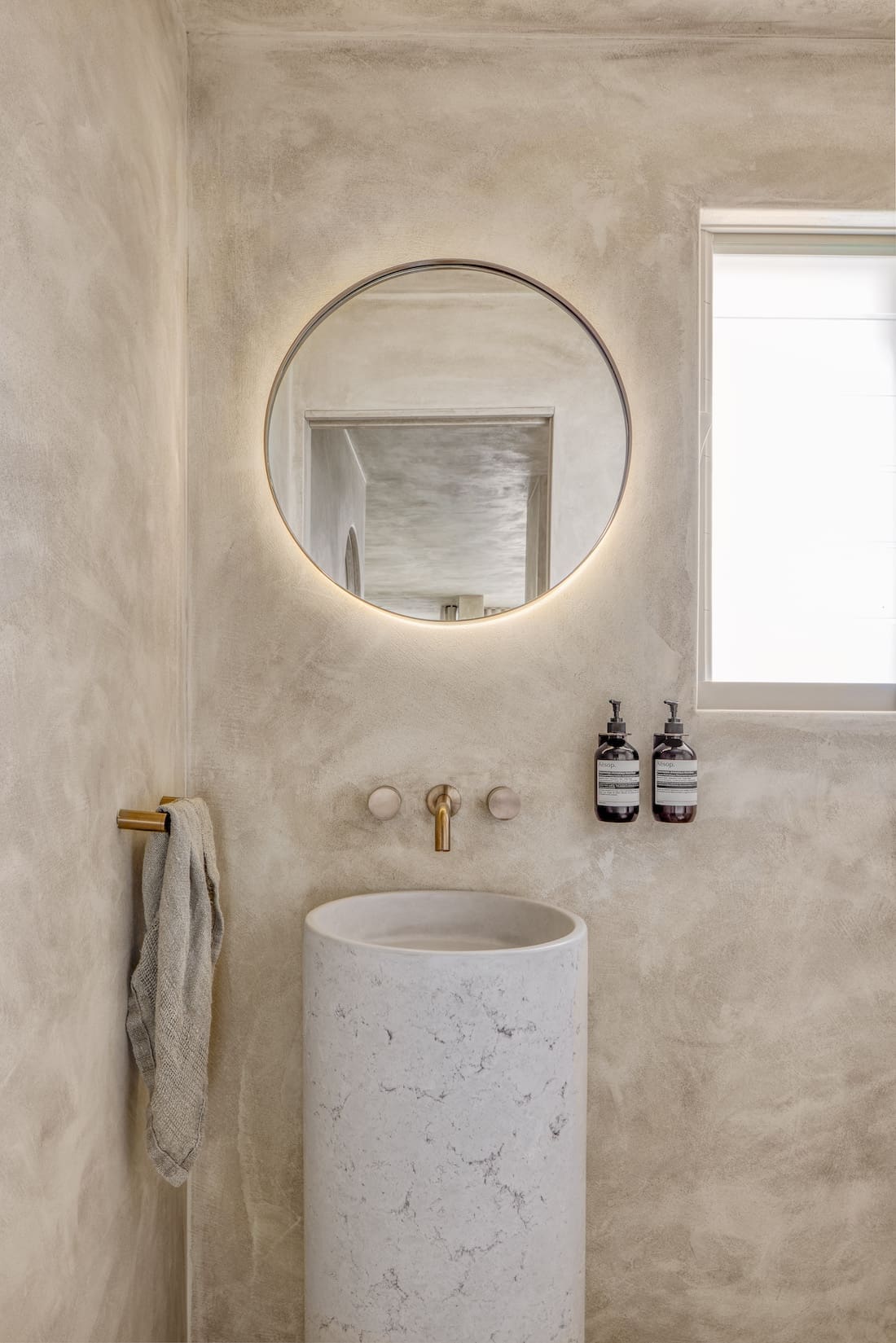 Powder room with pedestal sink in Ruin X house