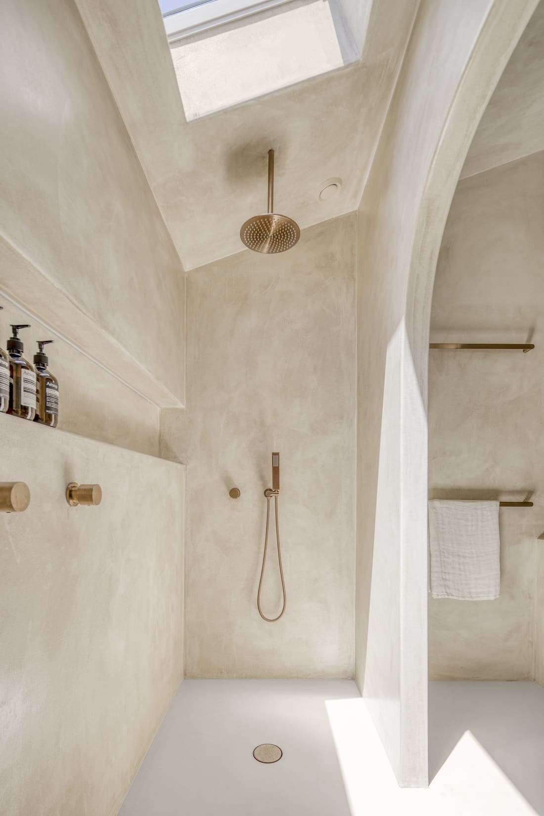Shower with skylight in Ruin X house